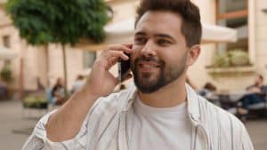 caucasian male businessman talking cellphone smili 2025 03 24 00 53 06 utc